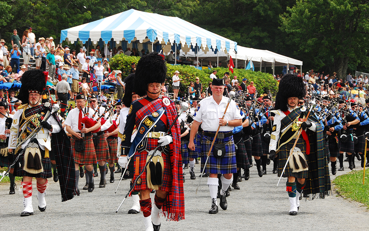 Bagpipers marching at Grandfather Mountain's MacRae Meadows for the Grandfather Mountain Highland Games