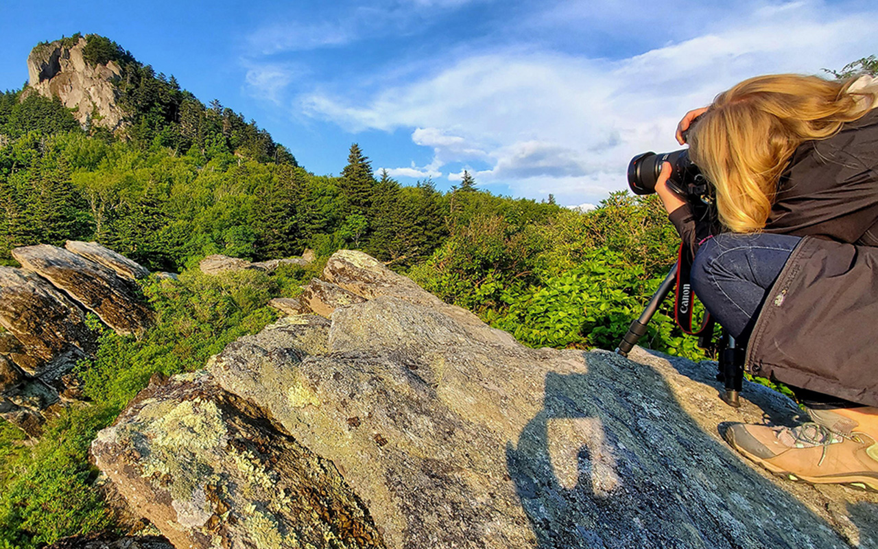 A photographer taking a picture of Grandfather Mountain.