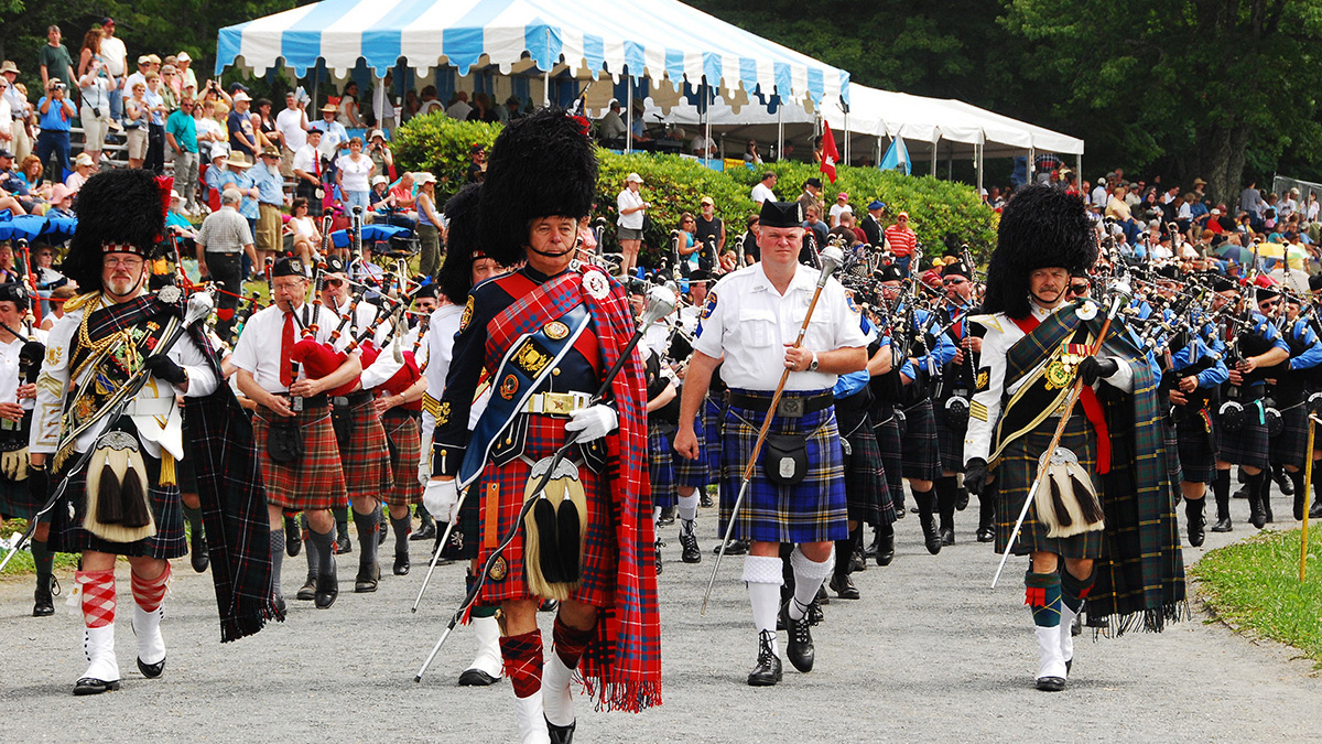 Grandfather Mountain Highland Games participants marching during the Parade of the Tartans